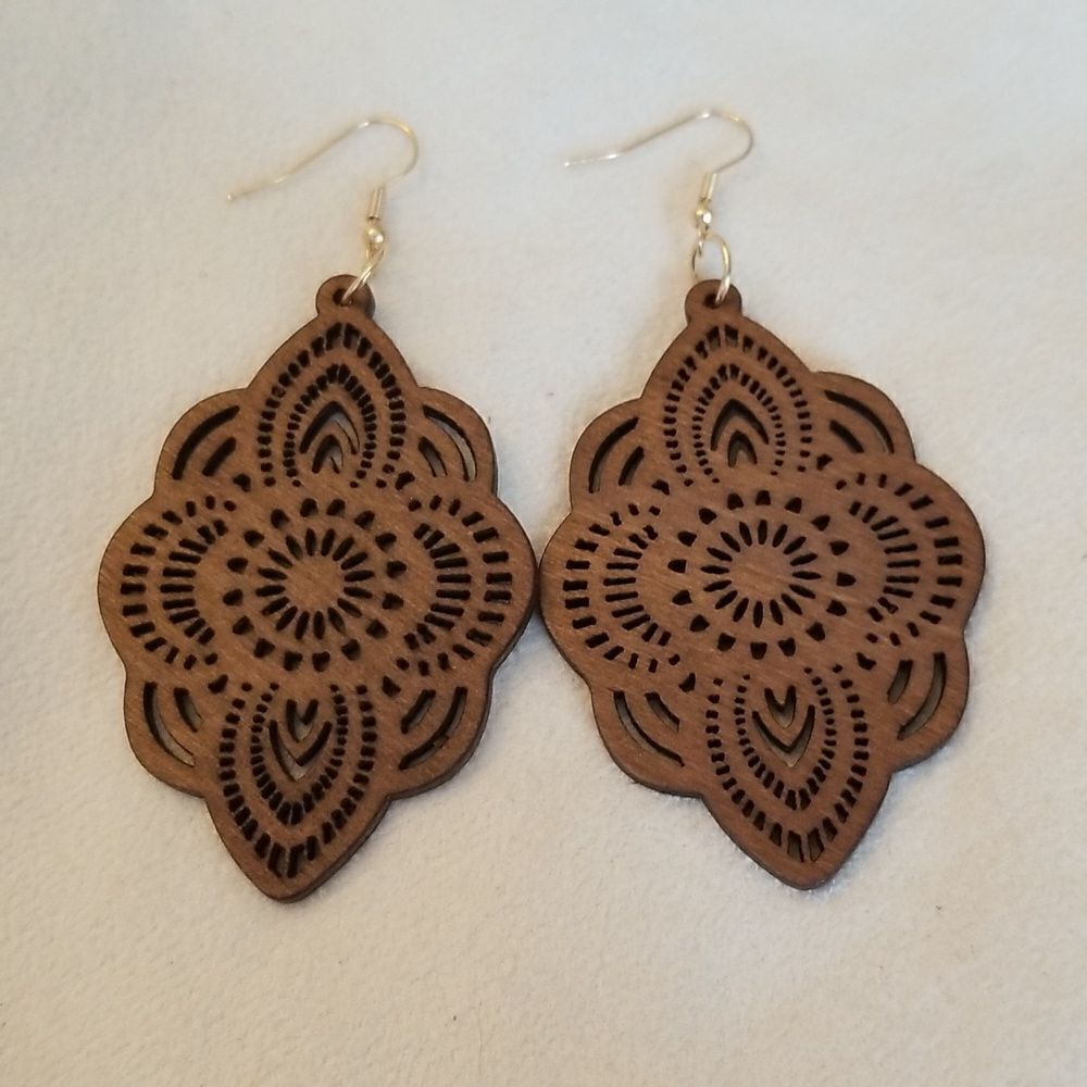 Carved dangle earrings